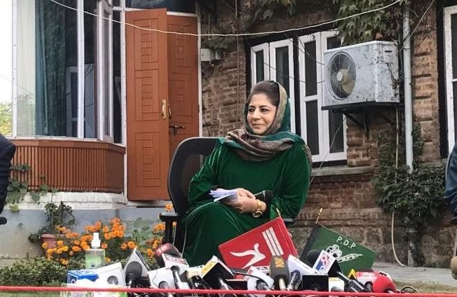 PDP Chief and former Chief Minister of Erstwhile State Mehbooba Mufti Displays State Flag during Press Conference