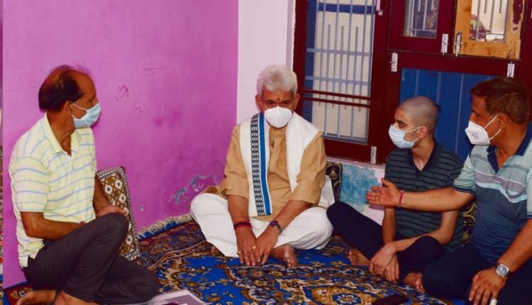 Lt Governor visits family of Councillor Rakesh Pandita, who was shot dead by terrorists