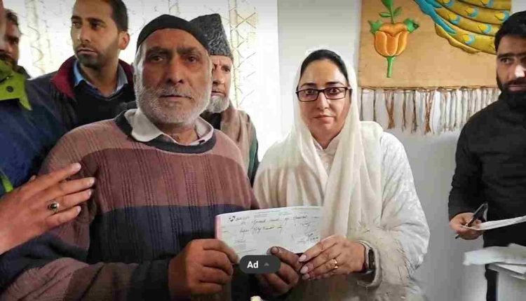 Dr Andrabi distributes relief cheques among Hazratbal fire victims today 