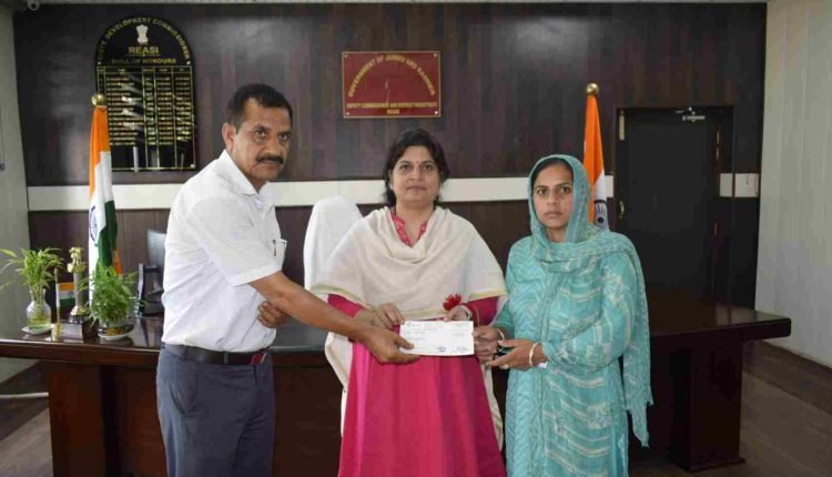 DC Reasi hands over relief cheque to family of accident victim