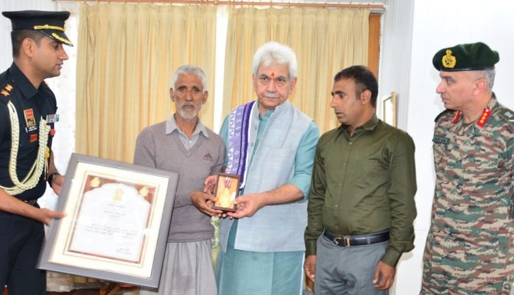 Lt Governor hands over Sarvottam Jeevan Raksha Padak to father of Martyr Mohammad Umar Dar