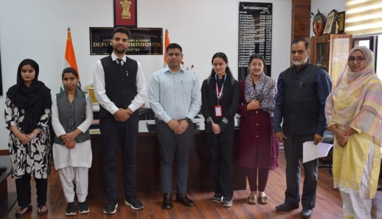 DC Vikas Kundal interacts with toppers of Board exams at Poonch